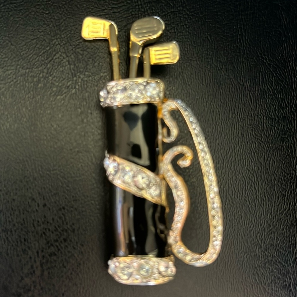 Vintage Golf Bag Brooch Pin
Gold Tone Clubs with Crystals on Black Enamel Bag - Picture 5 of 5